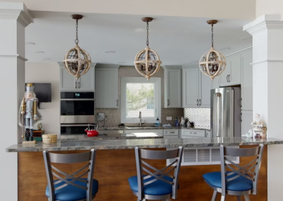 STONE OAK KITCHEN REMODEL - Traditional kitchen with bar top and large custom columns.