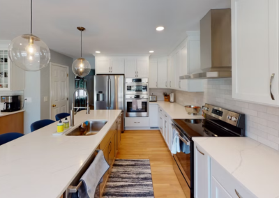 SYLVANIA KITCHEN REMODEL - Long kitchen wall, Tile backsplash, Island sink, quartz countertops, double ovens