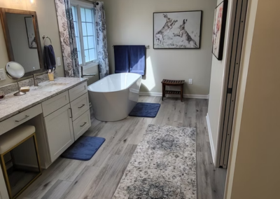 COUNTRY WALK BATHROOM REMODEL - After, vaulted ceilings, skylight, standalone tub, granite countertop, LVT flooring
