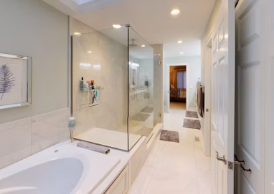 LONG BATHROOM REMODEL - Long bathroom remodel with tiled walk-in shower, tiled bench, glass surround, jetted tub and tile flooring